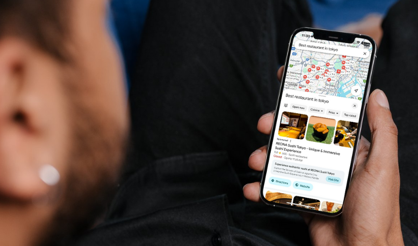 Person searching for best restaurant on Google Maps, showing local SEO results on a smartphone.
