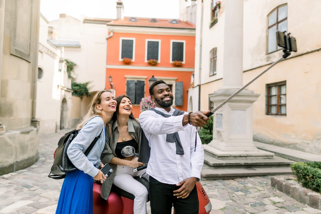 Friends enjoying travel package experience while sightseeing in Europe